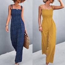 Jumpsuit med prickigt mönster, knytband i midjan och vida ben för en avslappnad look