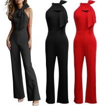 Elegant ärmlös jumpsuit med breda ben och rosett i enfärgad design