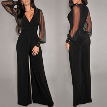 Sexig V-ringad Gaze Delad Långärmad Nit Högmidjad Jumpsuit med Vida Ben