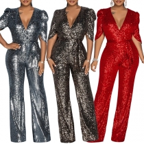 Elegant paljettklädd jumpsuit med vida ben och volangdetaljer
