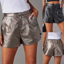 Vintage mellanhöga PU-shorts i konstläder med sidofickor