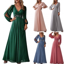 Elegant och enfärgad V-ringad långärmad maxi-festklänning med slits i hög höjd.