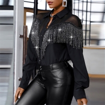 Sexig halvgenomskinlig blus i genombruten spets med bling-bling och fransar