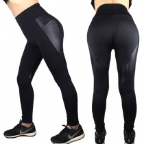 Modeflexibla svarta leggings i skarvad konstläder med medelhög midja