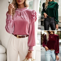 Elegant enfärgad mock neck puff långärmad sammetskjorta