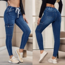 Mode Skinny Jeans för kvinnor med gammaltvättade sidofickor och dragsko i midjan