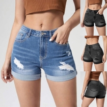Mode jeansshorts i gammal tvättad och distressed stil för kvinnor