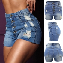 Gammaltvättade höga jeansshorts med knappdetalj