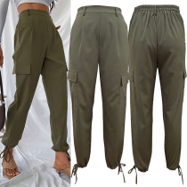 Casual byxor med sidolappsfickor och elastisk midja för kvinnor