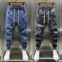 Mode på gatan: Elastiska midjelappar, dragkedja och fickor - Mänens gammaltvättade jeansbyxor