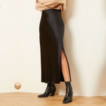 Elegant tinselkjol i enfärgad modell med sidslits