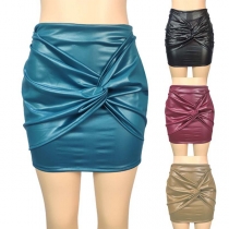 Fashionable streetwear PU skirt with cross-cross ruched design.