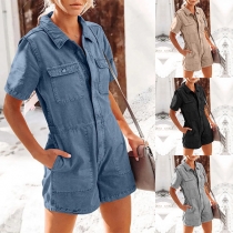 Vintage denim romper with short sleeves, patch pockets, and stand collar