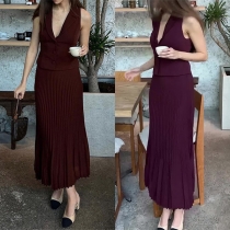 Elegant tvådelat set med ärmlös väst och plisserad kjol
