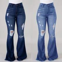 Trendiga jeans med nödställd look, vida ben och fransade fållar