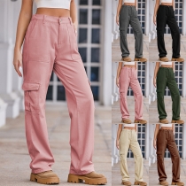 Casual enfärgade midjehöga jeans med sidofickor i rakt snitt