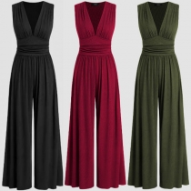 Moderiktig enfärgad V-ringad ärmlös hög jumpsuit med vida ben