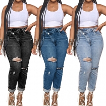 Gatumode asymmetrisk midja distressed vintage tvättade jeans