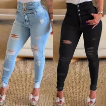 Knappförsedda modehögst jeans i gammaltvättad denim
