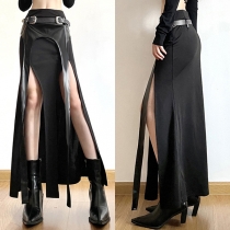 Maxikjol i konstläder med oregelbunden nederkant och framslits för street fashion