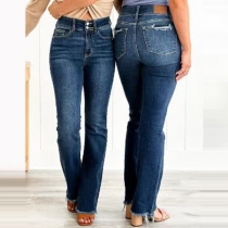 Modeknapp Höghus slitna kanter Vintage tvättade jeans