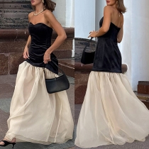 Elegant axelbandslös festklänning i kontrastfärgad maxi-design