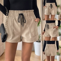 Shorts med elastisk midja och fickor i dragskostil