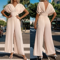 V-ringad Batwing kortärmad rygglös jumpsuit med hög midja och plisserad design