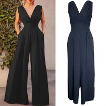 Elegant enfärgad ärmlös V-ringad rygglös jumpsuit med vida ben och hög midja