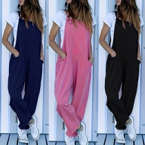 Lös enfärgad jumpsuit med sidfickor och hängslen
