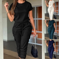 Avslappnad Ensfärgad Rundhals Kortärmad Resårmidja Jumpsuit med Sidofickor