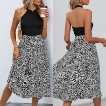Halterneck ärmlös klänning med leopardmönster och rygglös design