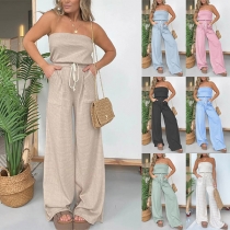 Sexig randig axelbandslös jumpsuit med elastisk midja och fickor, vida ben