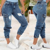 Höga jeansshorts med slitna fickor i gatumode-stil