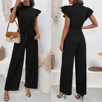 Elegant jumpsuit med volymiösa ärmar, liten krage och hög midja