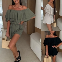 Enfärgad jumpsuit med volangkant och asymmetrisk axeldesign