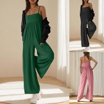 Ärmlös jumpsuit med avslappnad passform, strumpebanddetaljer och vida ben
