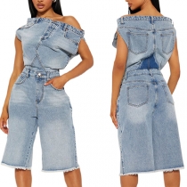 Jumpsuit i denim med tunna axelband och slimmad passform