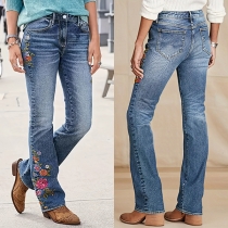 Slim fit-jeans med broderade detaljer, låg midja och högstretchresår i midjan