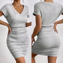 Kort plisserad minikjol i enfärgad design