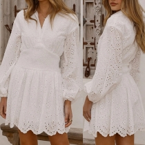 Moderiktig V-ringad långärmad klänning med cinch midja och urringning