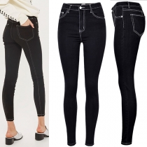 Högmidjade jeans i slim fit med eleganta veck