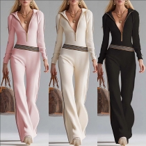 Jumpsuit med långa ärmar i ribbad stickning och kontrasterande paneler