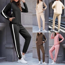 Tvådelat sportset med sidorandig design – tröja och joggers