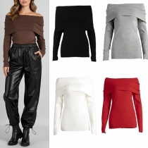 Trendig stickad topp med långa ärmar och utskurna axlar