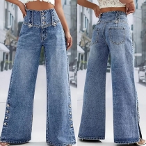 Högmidjade jeans med vida ben, knappgylf och sidoknappsslits – vintage-tvättat denim