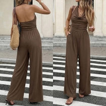 Damjumpsuit – ryggfri draperad V-ringning, hög midja och vida ben