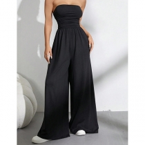 Sexig axelbandslös jumpsuit med markerad midja och vida ben