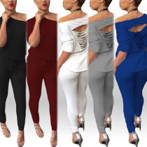 Tvådelat set: Sexig off-shoulder topp med revor + byxor