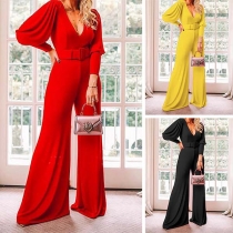 Sexig jumpsuit med djup V-ringning, lanternärm och hög midja i enfärgat